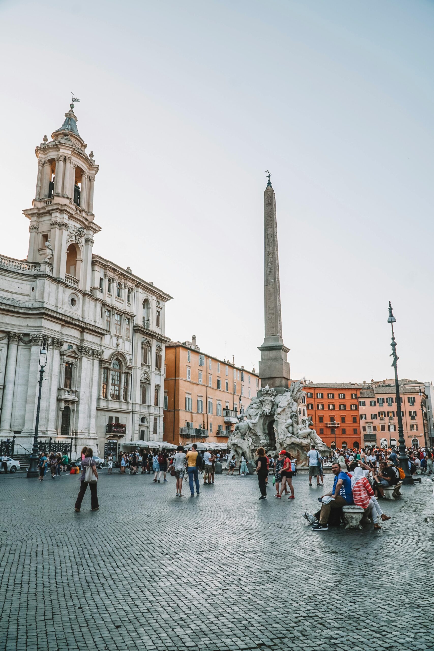 A bustling scene at Piazza Navona in Rome, showcasing its iconic baroque architecture and lively atmosphere.